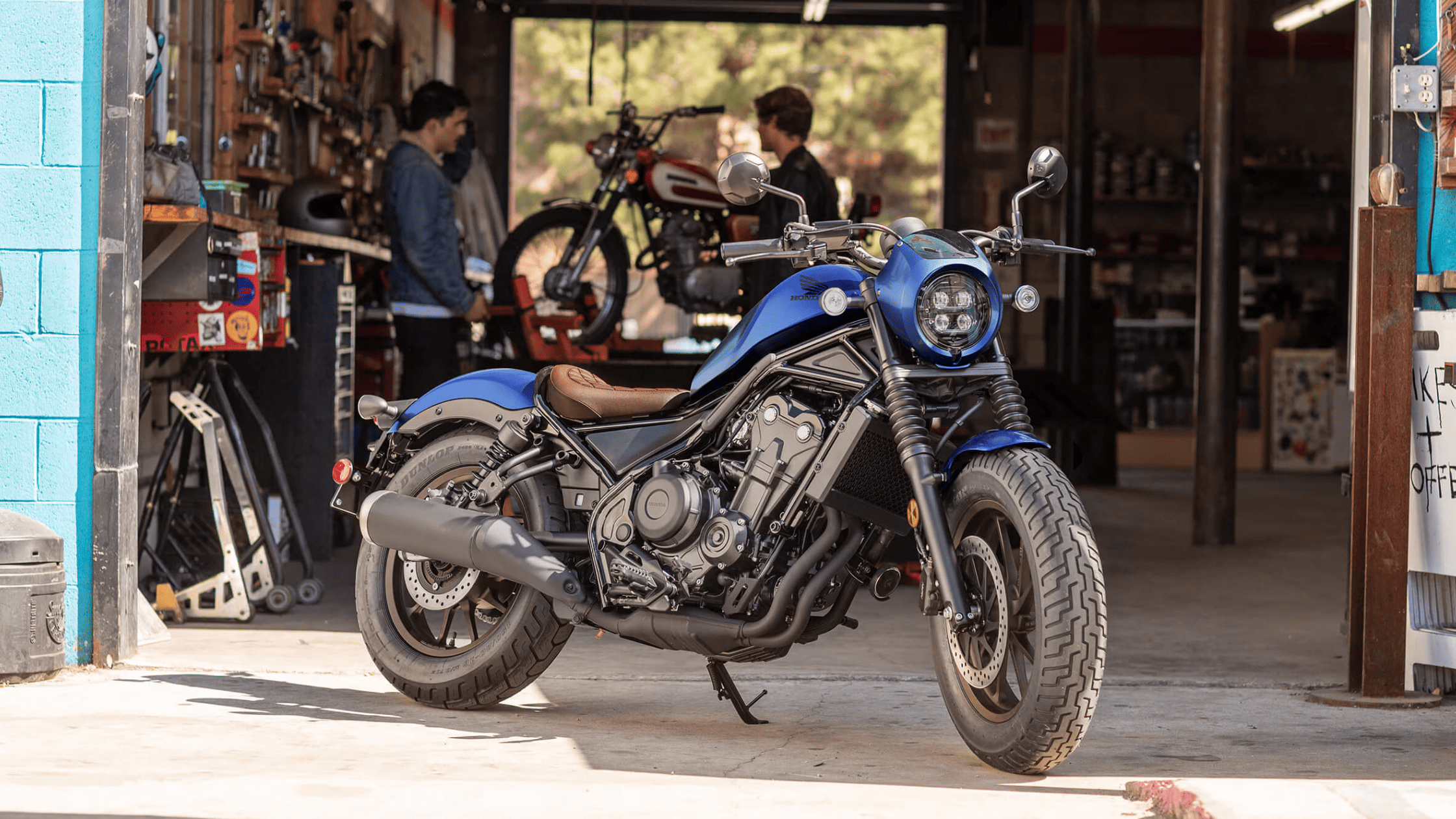 Close-up of 2025 Honda Rebel 500 LED headlight and turn signals with Honda logo on matte fuel tank